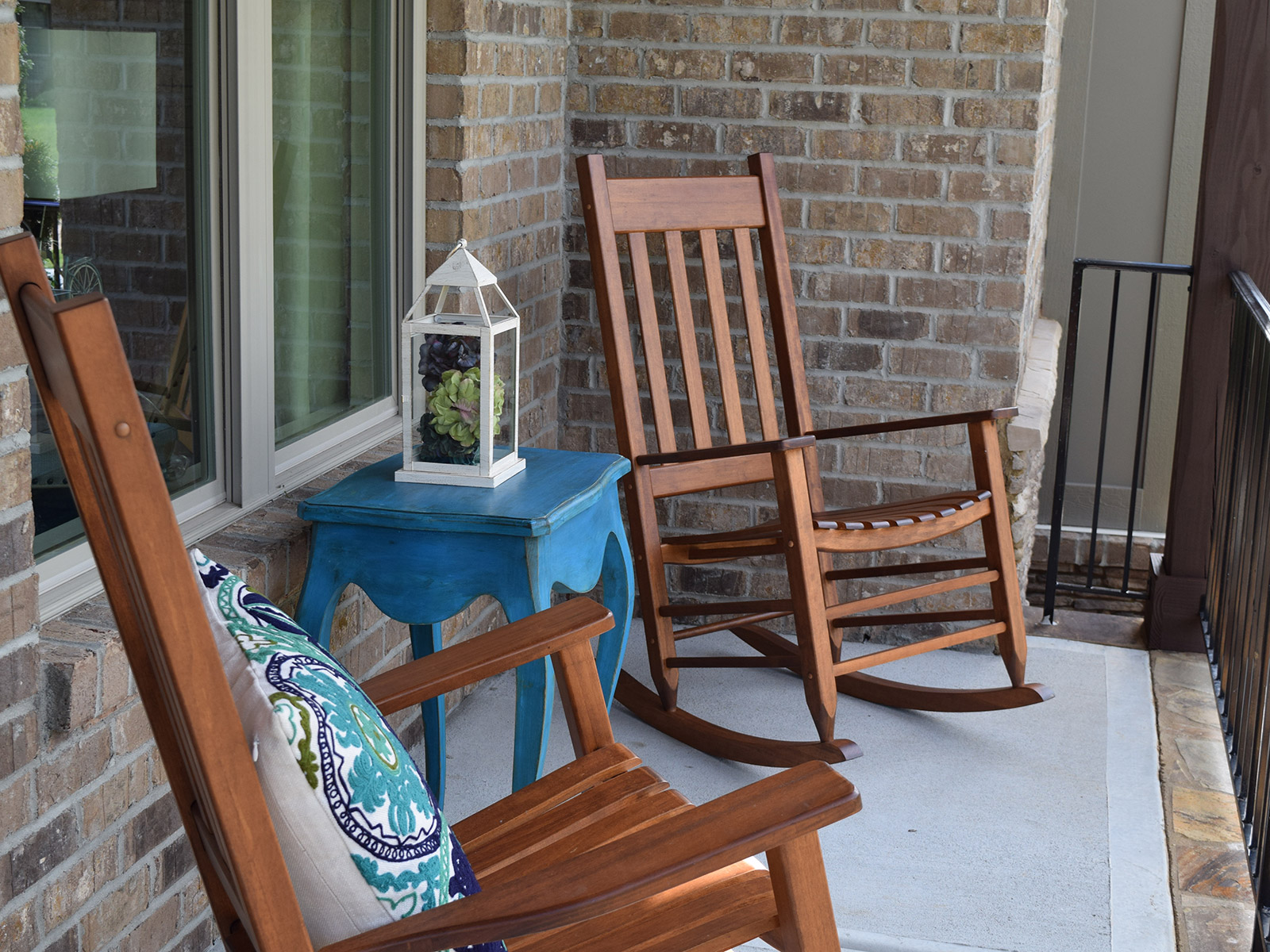 Enjoy the front porch of the Crawford plan featuring a brick front exterior.