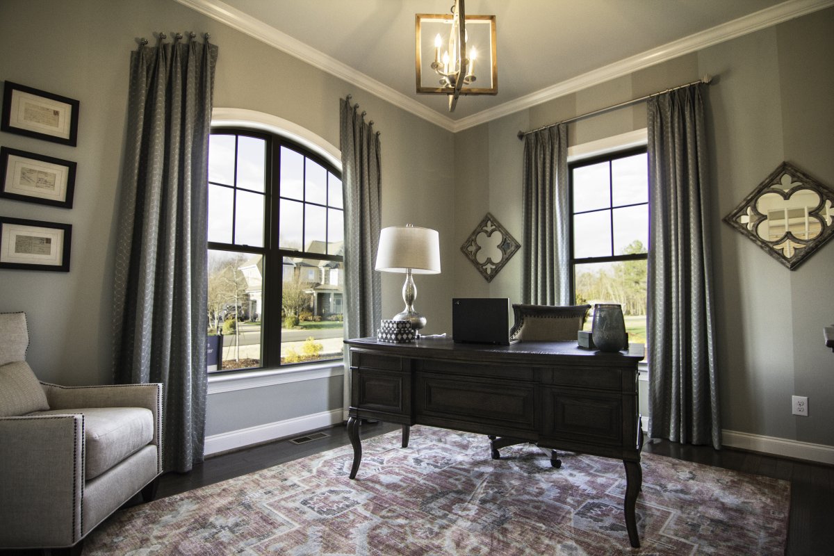 The study in the Crawford plan at Banks Pointe features 10' ceilings and arch top windows.